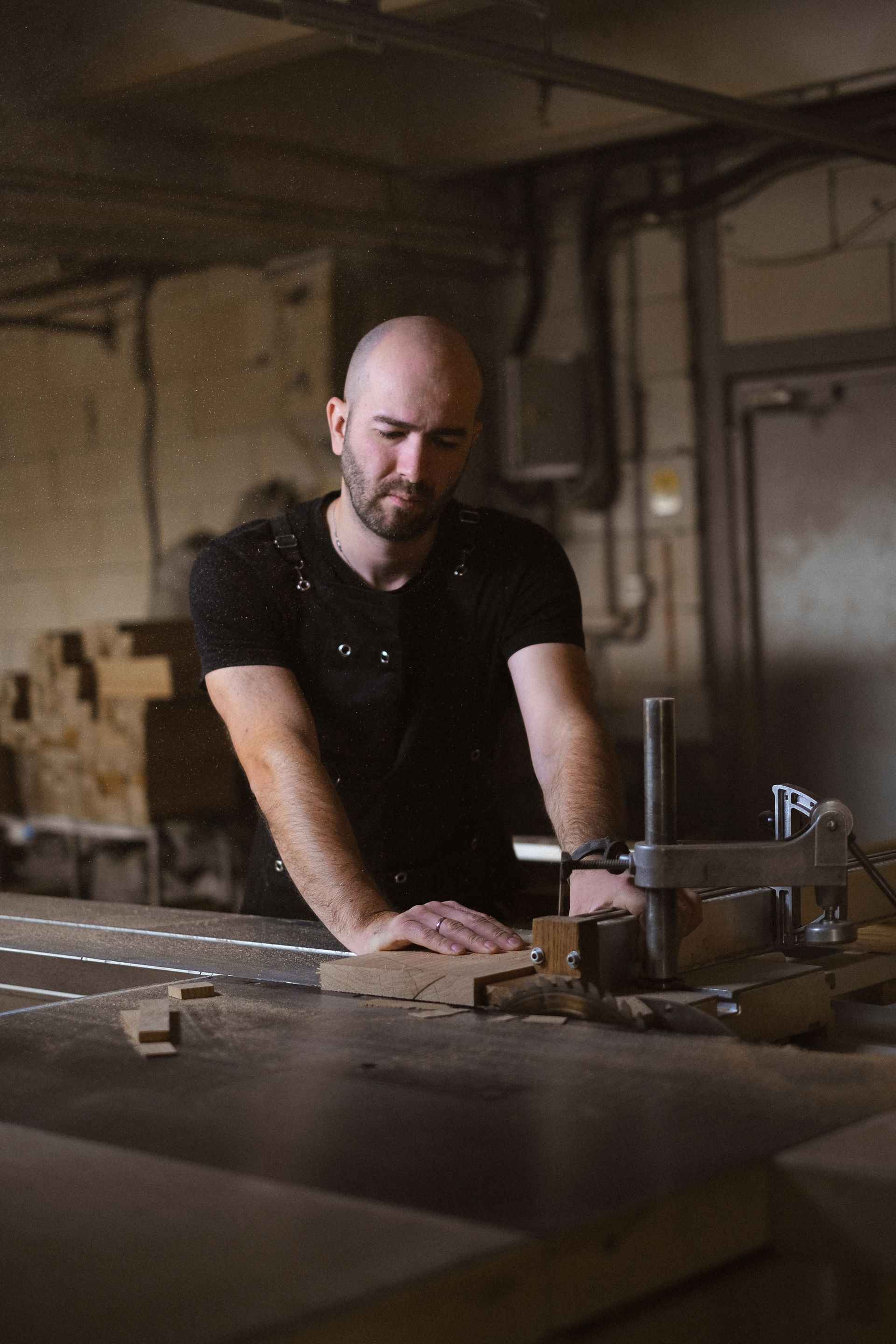A cabinetmaker working late at the bench